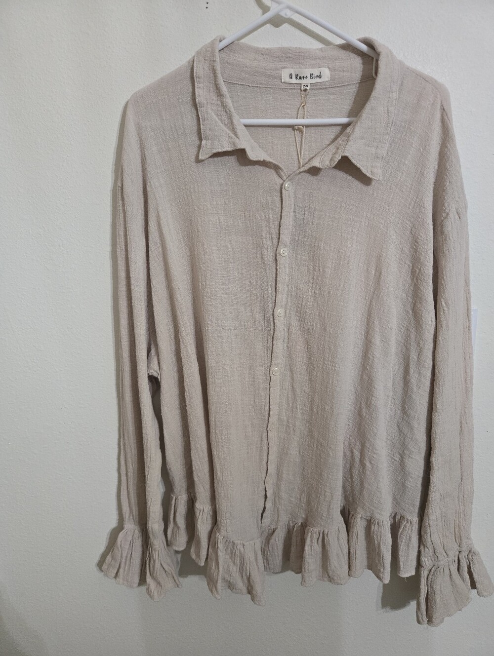A Rare Bird Beige Ruffle-Hem Button-Down Blouse